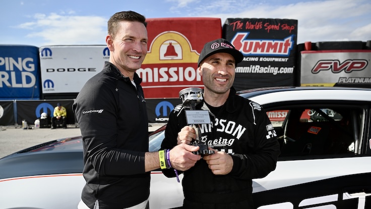 Dodge CEO Matt McAlear presents the championship trophy to John O’Malley
