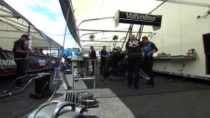 Blake Alexander's Top Fuel team thrashes in the pits between rounds at Sonoma
